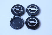 Opel 59mm Mustat Vannekeskiöt (4kpl sarja)