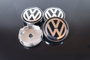 Volkswagen Kromi-Mustat 60mm Vannekeskiöt (4kpl sarja)
